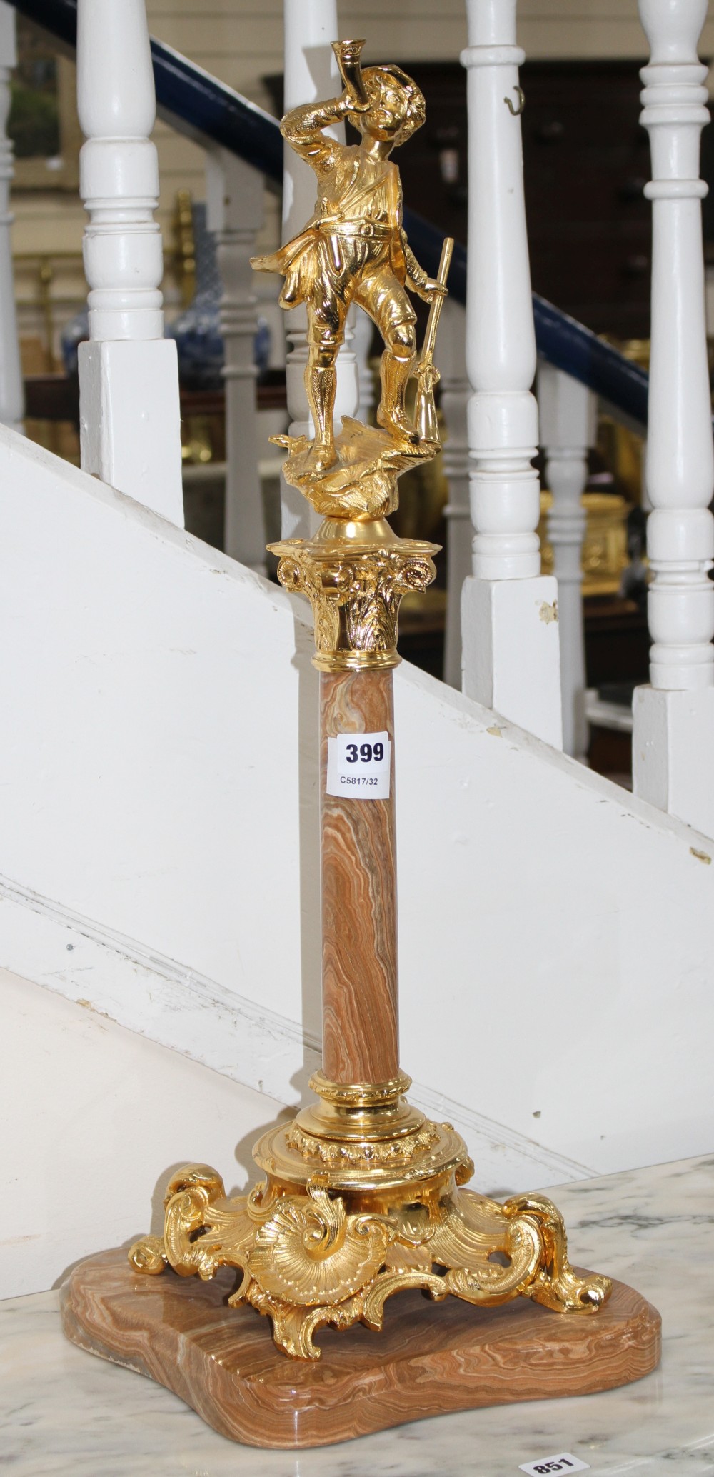 An ornate Italian gilt metal and marble centrepiece, modelled with a huntsman blowing his horn, height 72cm